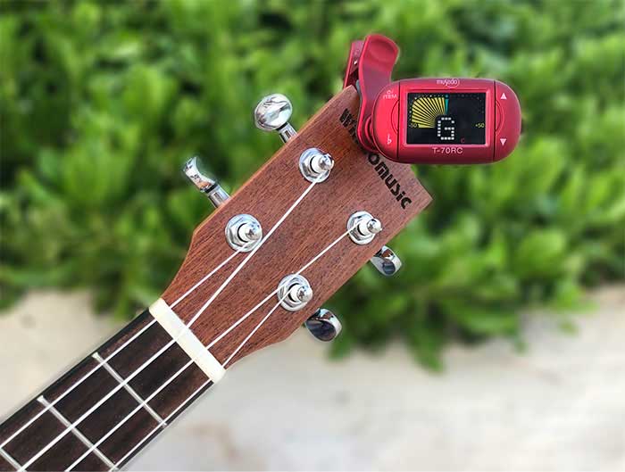 electronic ukulele tuner attached to a ukulele